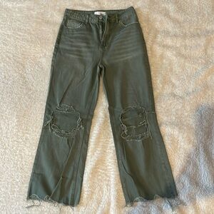 Green distressed cropped jeans